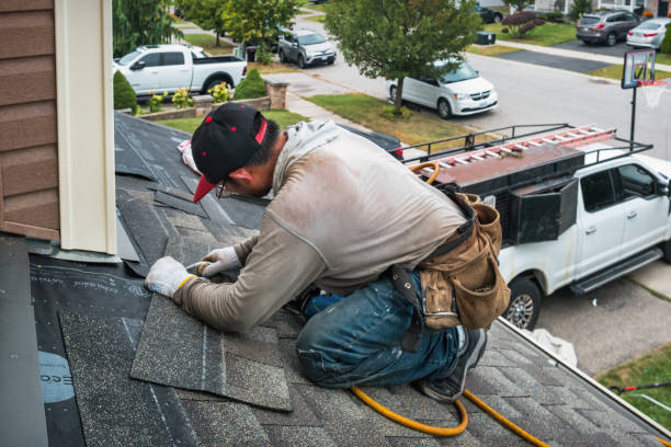 Professional Roof Replacement technician working in Wilder, VT
